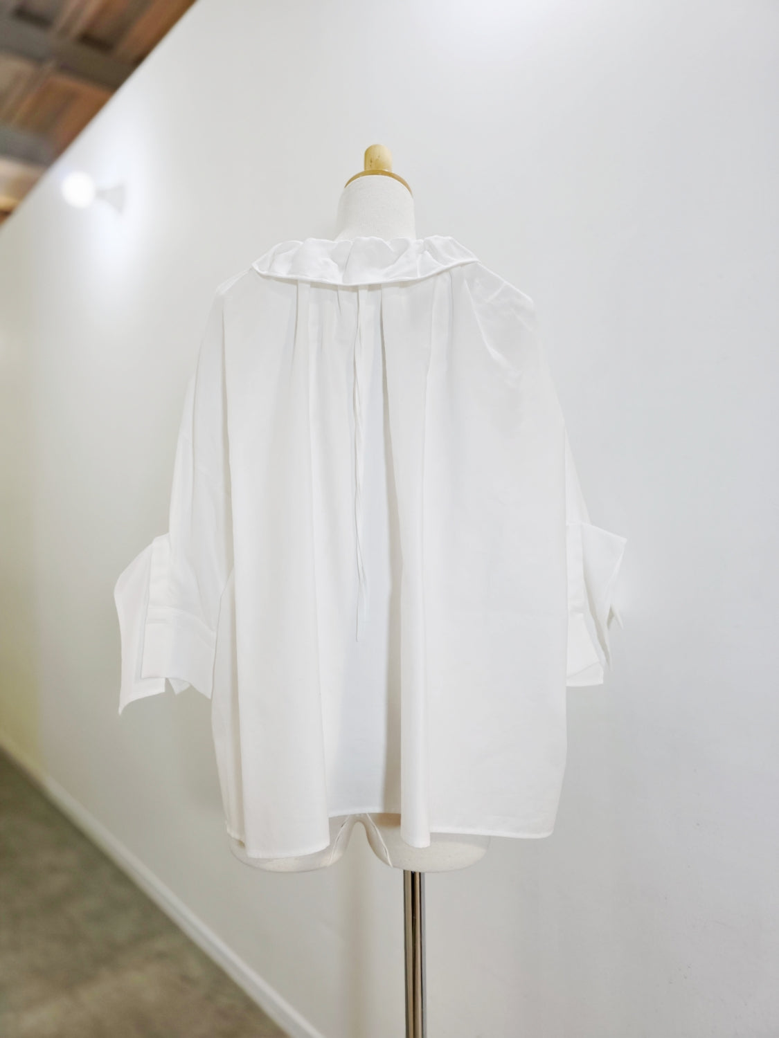 ENFOLD HIGH-NECK BLOUSE