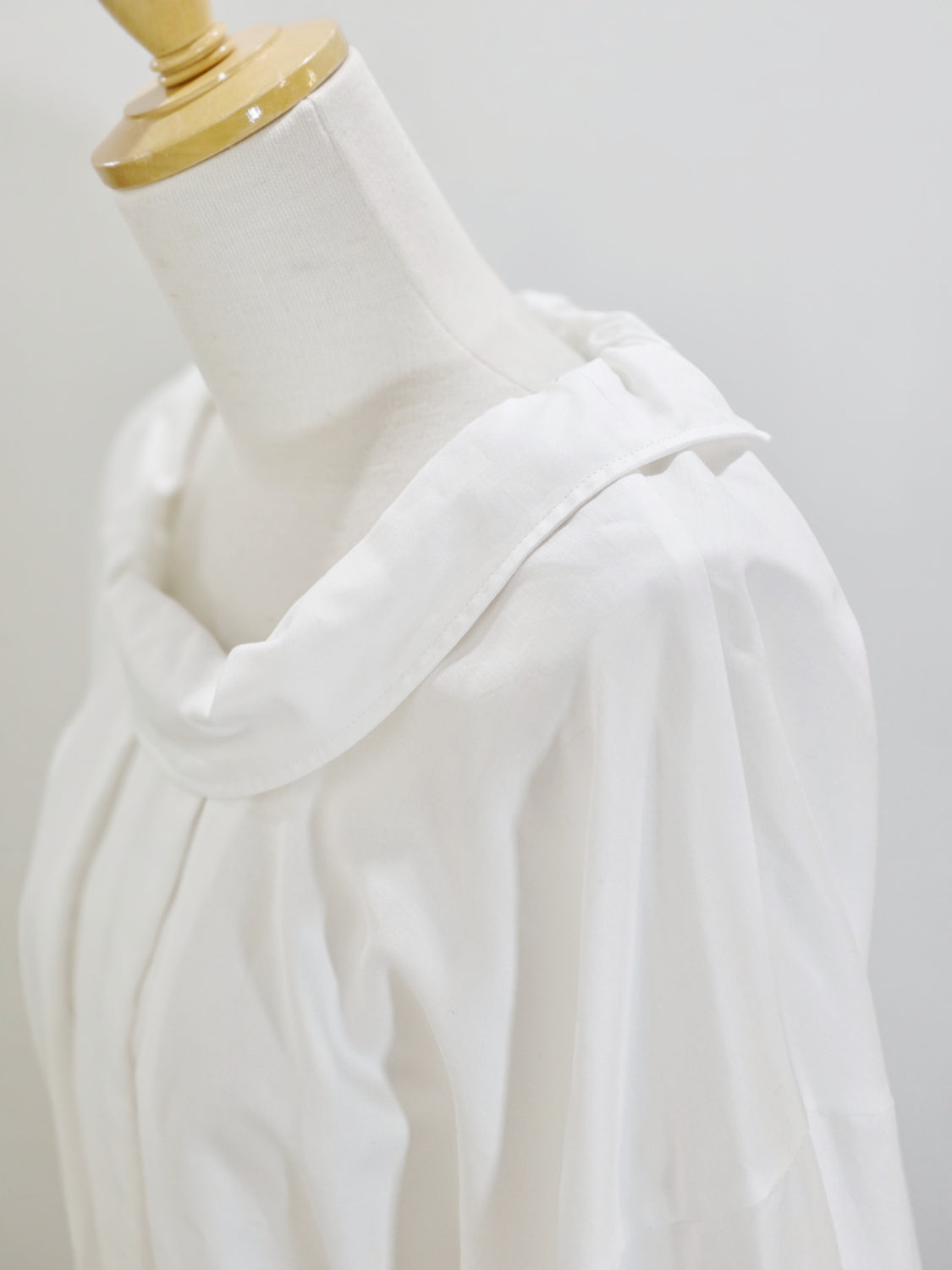 ENFOLD HIGH-NECK BLOUSE