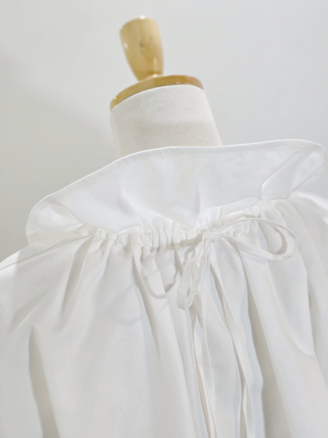ENFOLD  HIGH-NECK BLOUSE